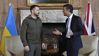 UK PM Rishi Sunak and Ukraine's President Zelenskyy, walk in the garden at Chequers, the premier's official country residence, in Aylesbury, England, Monday, May 15, 2023.
