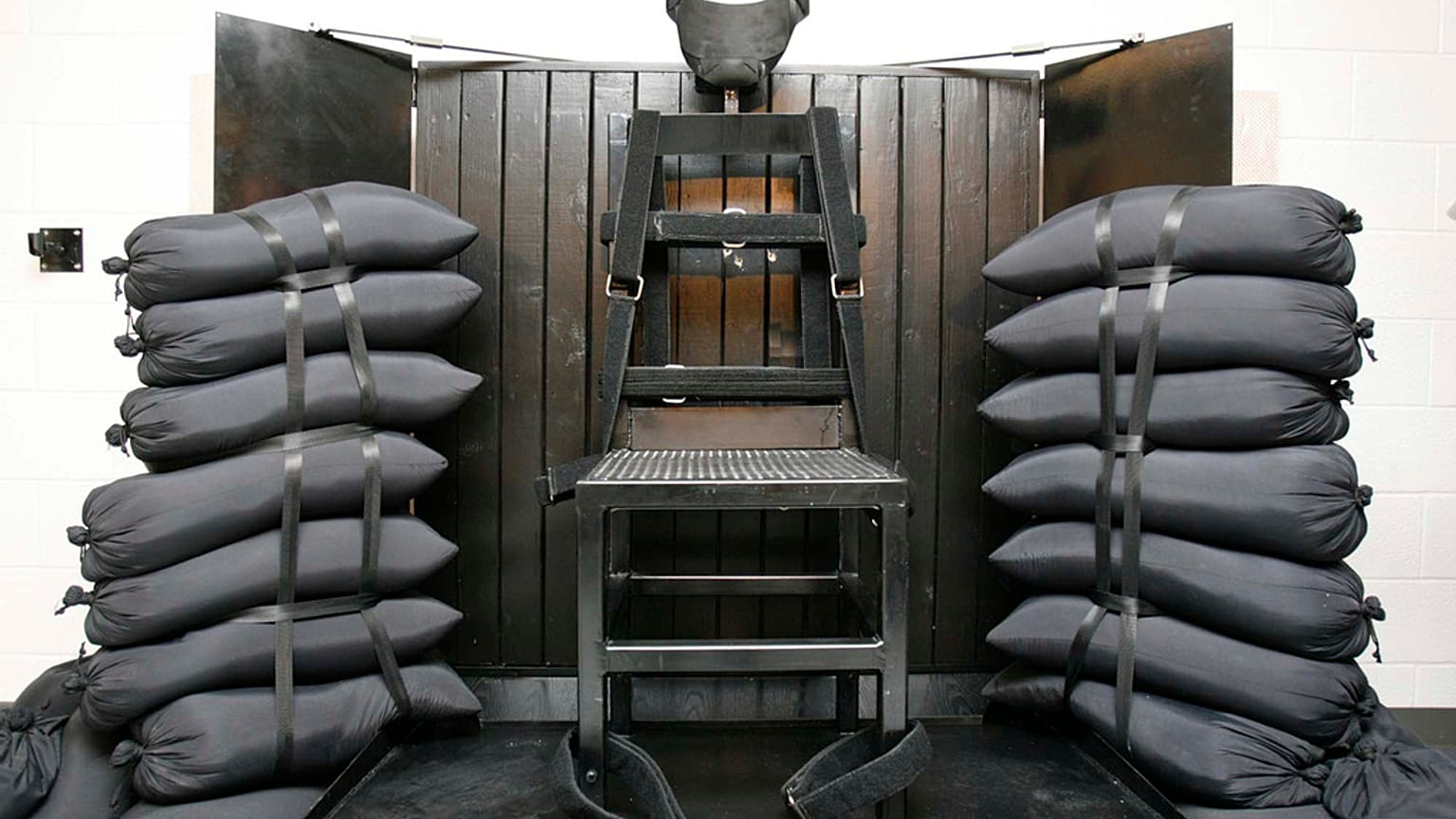 FILE - A chair sits in the execution chamber at the Utah State Prison on June 18, 2010, after Ronnie Lee Gardner was executed by firing squad in Draper, Utah. 