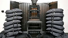 FILE - A chair sits in the execution chamber at the Utah State Prison on June 18, 2010, after Ronnie Lee Gardner was executed by firing squad in Draper, Utah. 