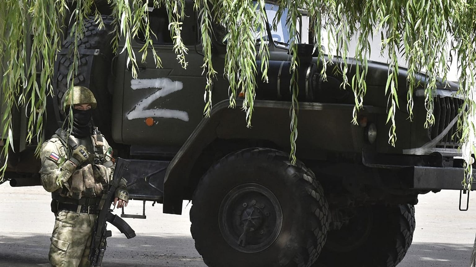 A Russian serviceman guards a grain elevator in Melitopol, Zaporizhzhia region, on July 14, 2022, amid the ongoing Russian military action in Ukraine.