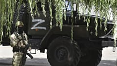 A Russian serviceman guards a grain elevator in Melitopol, Zaporizhzhia region, on July 14, 2022, amid the ongoing Russian military action in Ukraine.