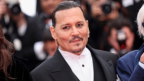 Johnny Depp poses for photographers upon arrival at the opening ceremony and the premiere of the film 'Jeanne du Barry' at the 76th international film festival in Cannes.
