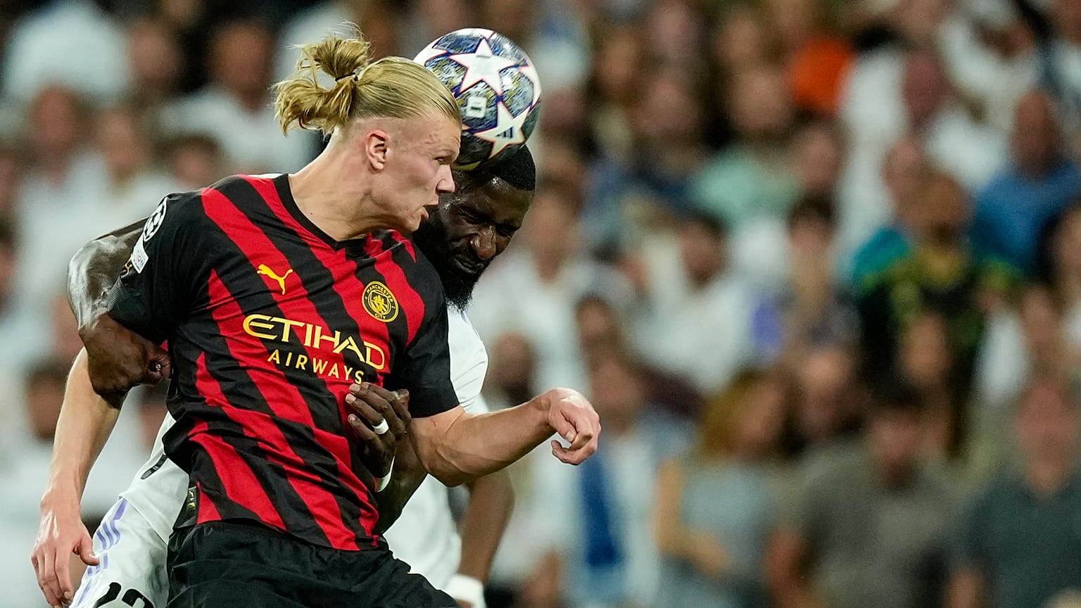 Manchester City's Erling Haaland with Real Madrid's Antonio Rudiger during the Champions League semifinal first leg match between Real Madrid and Manchester City, 9 May 2023
