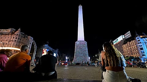 General view of the Obelisk covered with plastic bags as part of an artistic intervention on the eve of World Recycling Day in Buenos Aires, taken on May 16, 2023