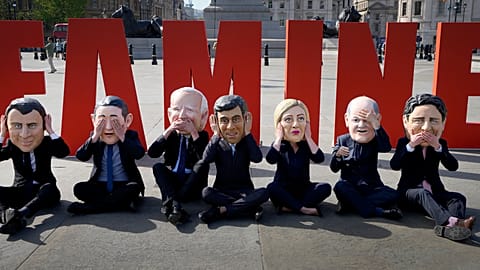 Oxfam's satirical 'big heads' of the G7 leaders pose ahead of the start of the G7 summit in Japan, in Trafalgar Square, London, Wednesday, May 17, 2023.
