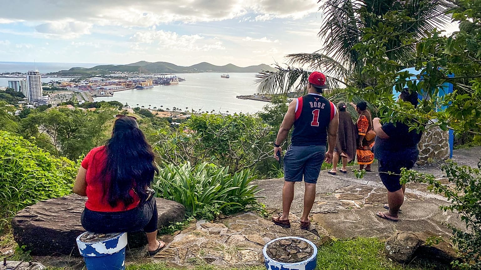 People look out toward the seafront from the Vierge du Pacifique in Noumea on May 19, 2023, after an earthquake hit the island.
