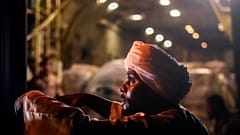 Sudanese Ayoub Abu Fatema, head of an NGO organization, receives tons of relief supplies, from The King Salman Humanitarian Aid and Relief Centre at Port Sudan airport, May 11