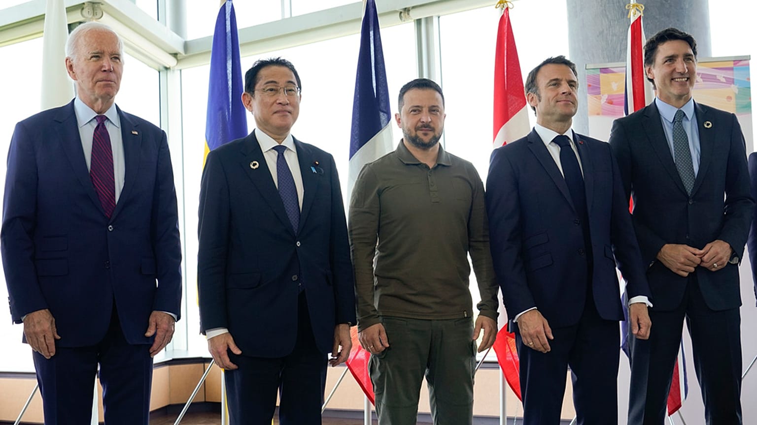 US President Joe Biden (far left), Japan's Fumio Kishida, (far right) Canadian leader Justin Trudeau and France's Emmanuel Macron stand with Ukrainne's Volodymyr Zelenskyy.