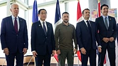 US President Joe Biden (far left), Japan's Fumio Kishida, (far right) Canadian leader Justin Trudeau and France's Emmanuel Macron stand with Ukrainne's Volodymyr Zelenskyy.