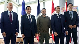 US President Joe Biden (far left), Japan's Fumio Kishida, (far right) Canadian leader Justin Trudeau and France's Emmanuel Macron stand with Ukrainne's Volodymyr Zelenskyy.