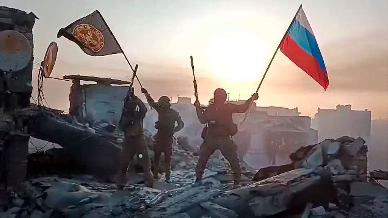 Russian national and Wagner flag