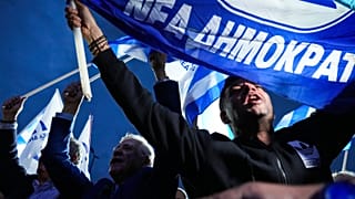 Supporters of Greece's Prime Minister and leader of New Democracy Kyriakos Mitsotakis shout slogans outside the headquarters of his party in Athens, Greece, 21 May 2023