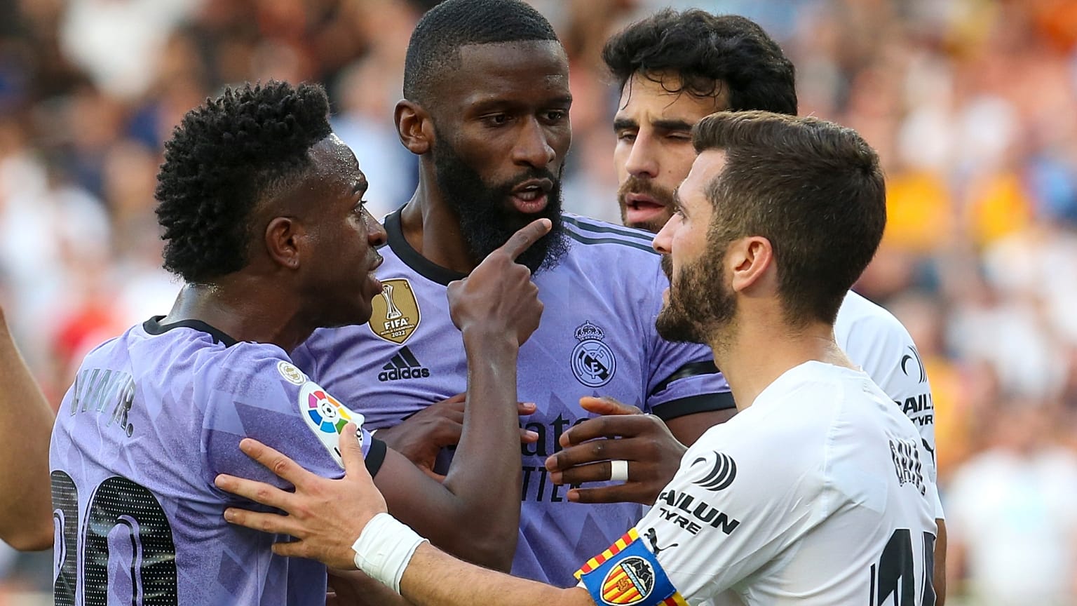 Real Madrid's Vinicius Junior, left, reacts during a Spanish La Liga soccer match between Valencia and Real Madrid, at the Mestalla stadium in Valencia, Spain, Sunday, May 21,