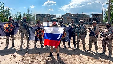 Yevgeny Prigozhin, the head of the Wagner Group military company speaks holding a Russian national flag in front of his soldiers in Bakhmut, Ukraine.