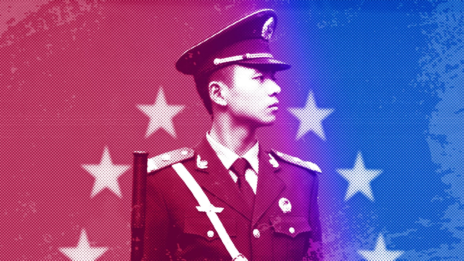 A Chinese paramilitary policeman stands on duty in front of the European flag outside the office of the EU delegation to China in Beijing, October 2011