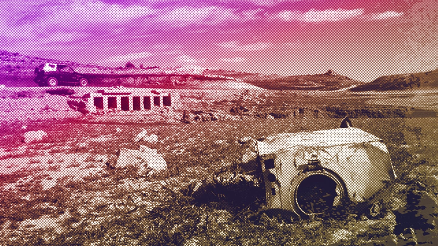 An old rusty washing machine is seen on the dry bed of the Entrepenas reservoir near Madrid, August 2006