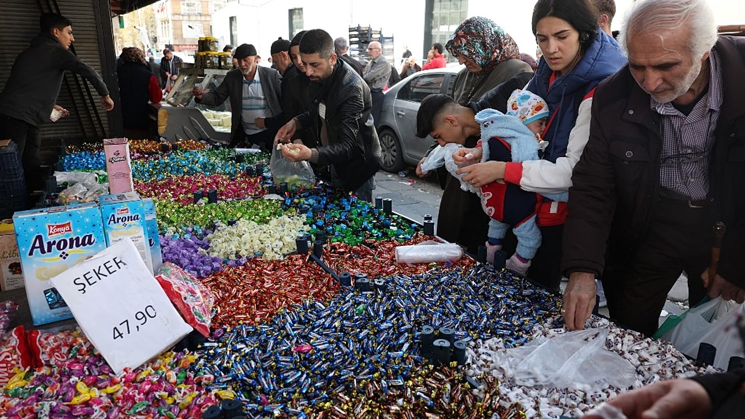 Shoppers browse candy and sweets at a market stall in the historical Ulus district of Ankara, on April 19, 2023.