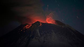 The Popocatepetl volcano erupts lava, ash and steam, seen from from Santiago Xalitzintla, Mexico, early Thursday, May 25, 2023. 
