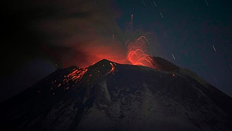 The Popocatepetl volcano erupts lava, ash and steam, seen from from Santiago Xalitzintla, Mexico, early Thursday, May 25, 2023. 