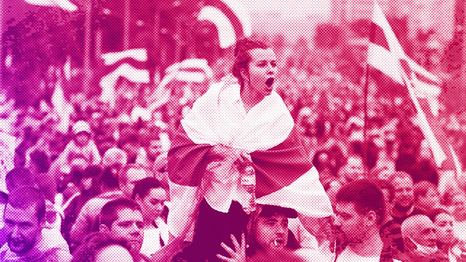 a woman covers herself with an opposition flag in front of a police line near the residence of Alexander Lukashenka in Minsk, September 2020
