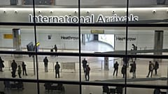 People in the arrivals area at Heathrow Airport in London, Jan. 26, 2021. 