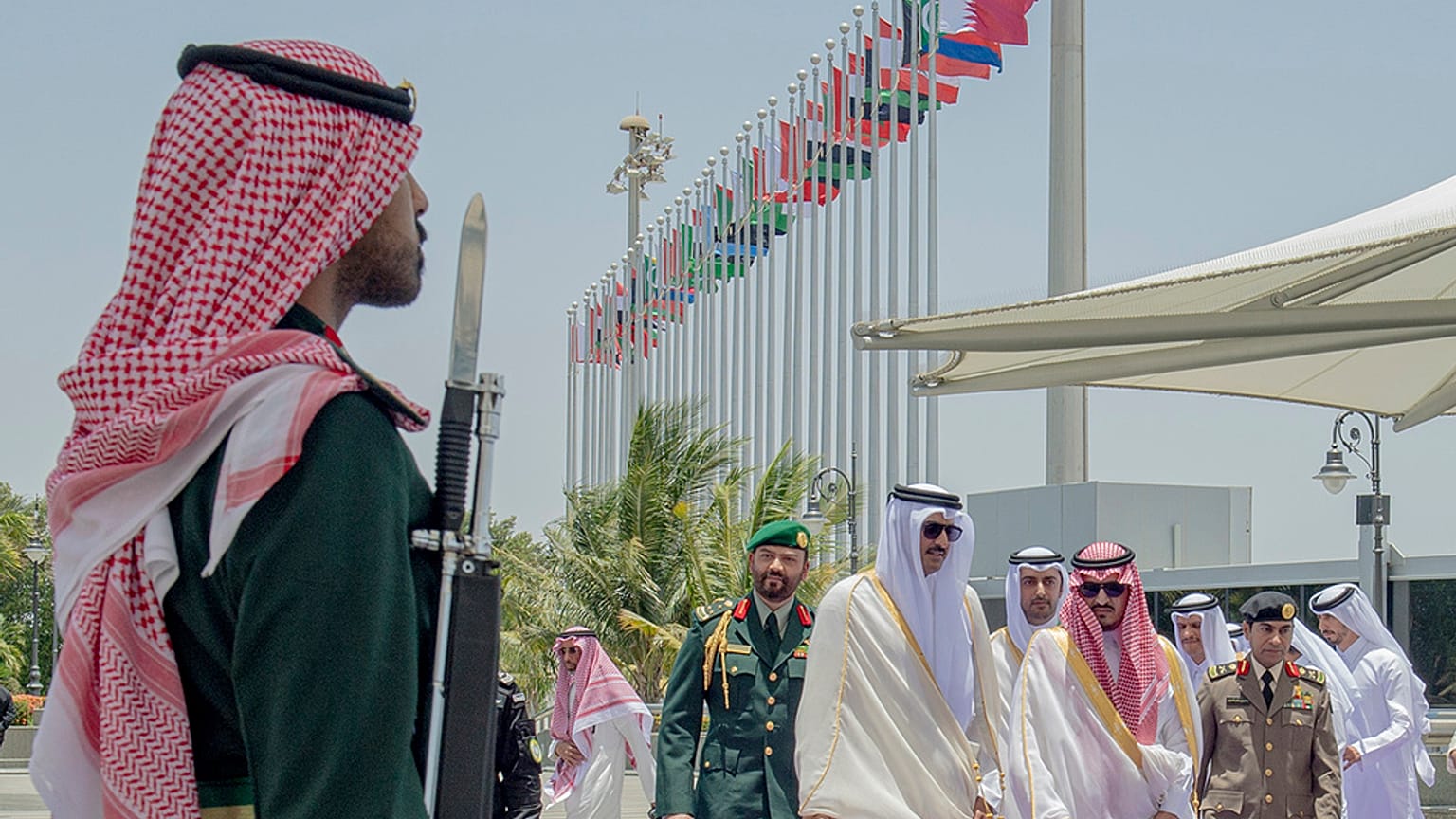 Emir of Qatar Sheikh Tamim bin Hamad Al Thani, center, accompanied by Prince Badr Bin Sultan, deputy governor of Mecca, right, upon his arrival at Jeddah airport, Saudi Arabia