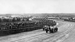 Race cars take the Dunlop Curve, while competing in the 13rd edition of the 24 hours of Le Mans car race, on June 15, 1935 in Le Mans. 
