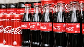 Bottles and cans of Coca-Cola