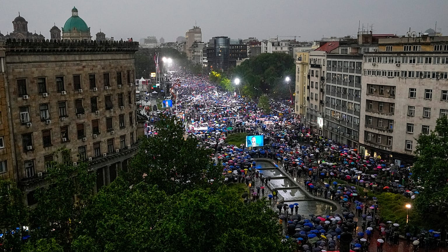 People attend a major rally in support of President Aleksandar Vucic in front of the Serbian parliament building in Belgrade, Serbia, Friday, May 26, 2023.