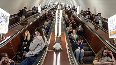 People take cover at metro station during a Russian rocket attack in Kyiv, Ukraine, Monday, May 29, 2023