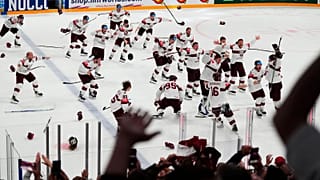 Latvian players celebrate the game-winning goal