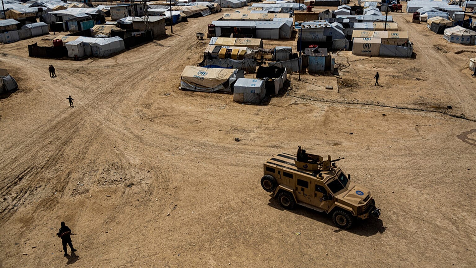 Kurdish forces patrol al-Hol camp, which houses families of members of the Islamic State group in Hasakeh province, Syria.