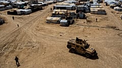 Kurdish forces patrol al-Hol camp, which houses families of members of the Islamic State group in Hasakeh province, Syria.
