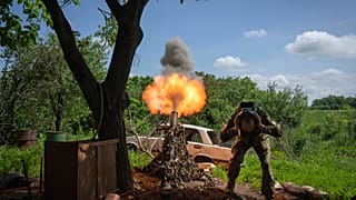 A Ukrainian soldier fires a mortar at Russian positions on the frontline near Bakhmut, Donetsk region, Ukraine, Monday, May 29, 2023.