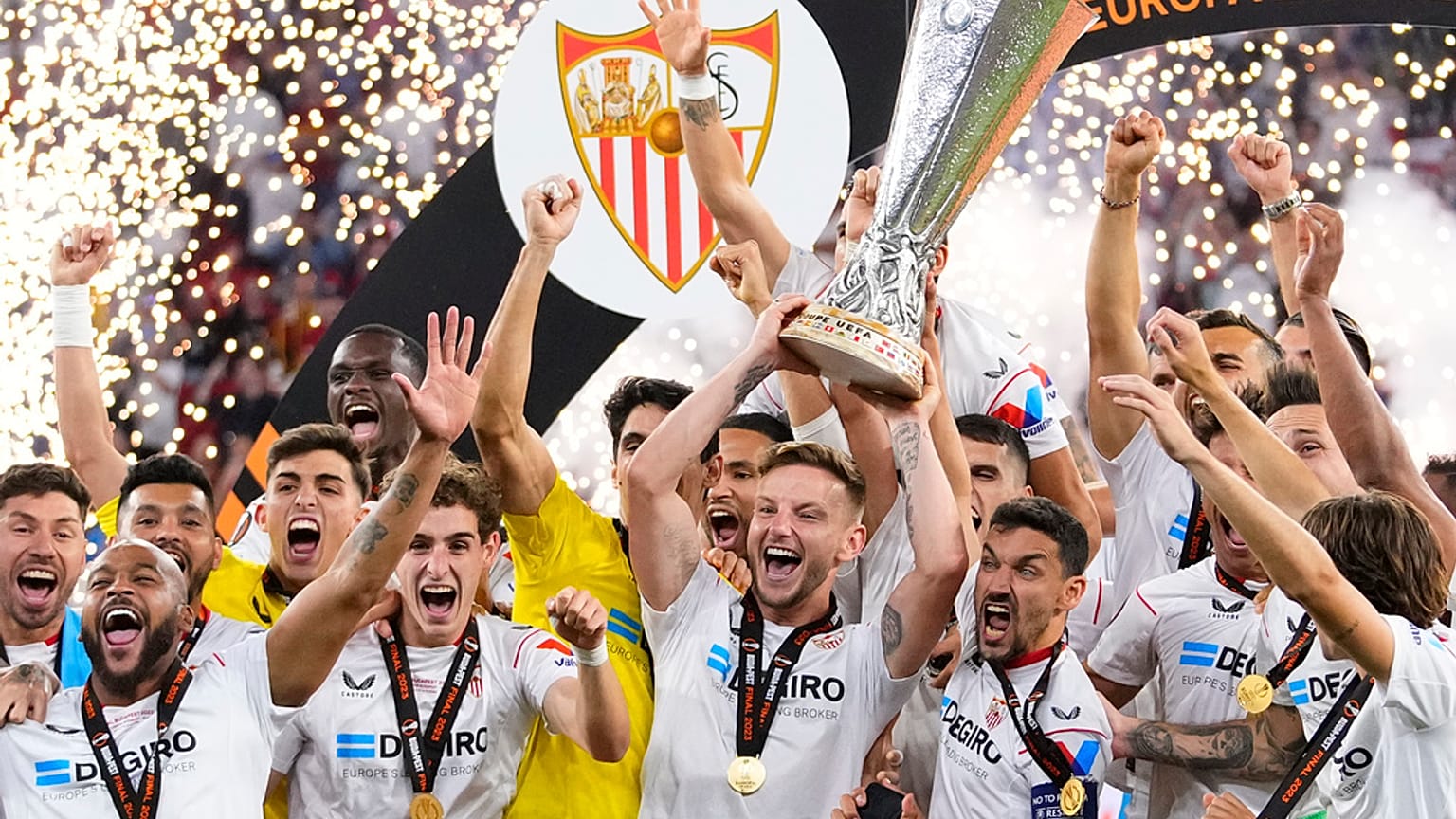Sevilla's team captains Ivan Rakitic and Jesus Navas, lift the Europa League trophy after beating AS Roma on penalties. Budapest, Hungary, May 31, 2023