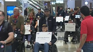 Procession of WWII veterans departing for Normandy  commemoration ceremony