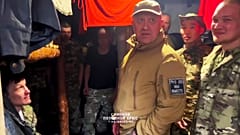 Wagner Group leader Yevgeny Prigozhin, centre, visits a Wagner unit at an undisclosed location.