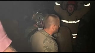 Rescuers try to reach victims trapped under rubble after a Russian airstrike on a residential district of Dnipro. June 3, 2023