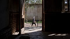 A girl walks to school on the first day of the school year, in Kabul, Afghanistan. 