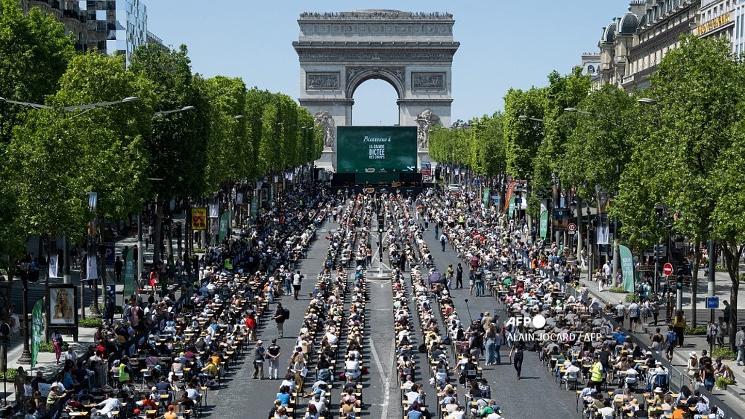 Paris' most iconic street, the Champs-Elysees, was transformed into an open-air mass "dictation" spellathon, Sunday 4 June 2023