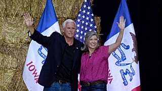 Former Vice President Mike Pence stands on stage with U.S. Sen. Joni Ernst, R-Iowa, during her Roast and Ride, Saturday, June 3, 2023, in Des Moines, Iowa.