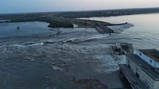 Image released by the Ukrainian Presidential Office, water runs through a breakthrough in the Kakhovka dam in Kakhovka, Ukraine, Tuesday, June 6, 2023