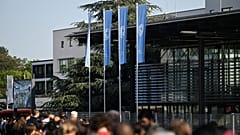 People wait in line to attend the Climate Change Conference in Bonn, Germany.
