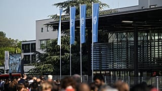 People wait in line to attend the Climate Change Conference in Bonn, Germany.