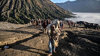 Members of the Tengger sub-ethnic group carries a goat for offering on the active Mount Bromo volcano as part of the Yadnya Kasada festival in Probolinggo, East Java.
