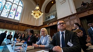 Ukraine's delegation waiting for judges to enter the World Court in The Hague, Netherlands