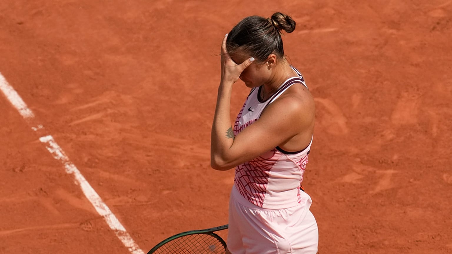 Aryna Sabalenka of Belarus reacts after missing a shot during the semifinal match of the French Open tennis tournament at the Roland Garros stadium in Paris, Thursday, June 8