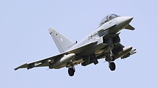 A Euro Fighter combat aircraft of the German Air Force lands in Kerpen, Germany, on 13 June during the Air Defender 2023 exercise.