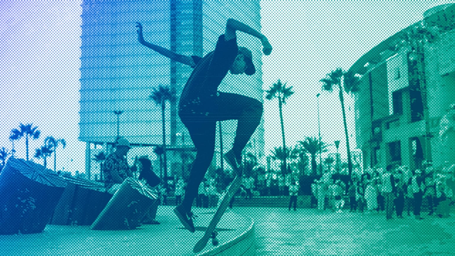 A youth skateboards as campaigners hold a rally for the upcoming legislative and regional elections in Rabat, September 2021