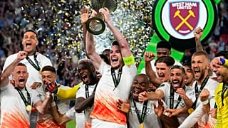 West Ham's Declan Rice lifts the trophy after winning the Europa Conference League final soccer match between Fiorentina and West Ham at the Eden Arena in Prague, Wednesday.